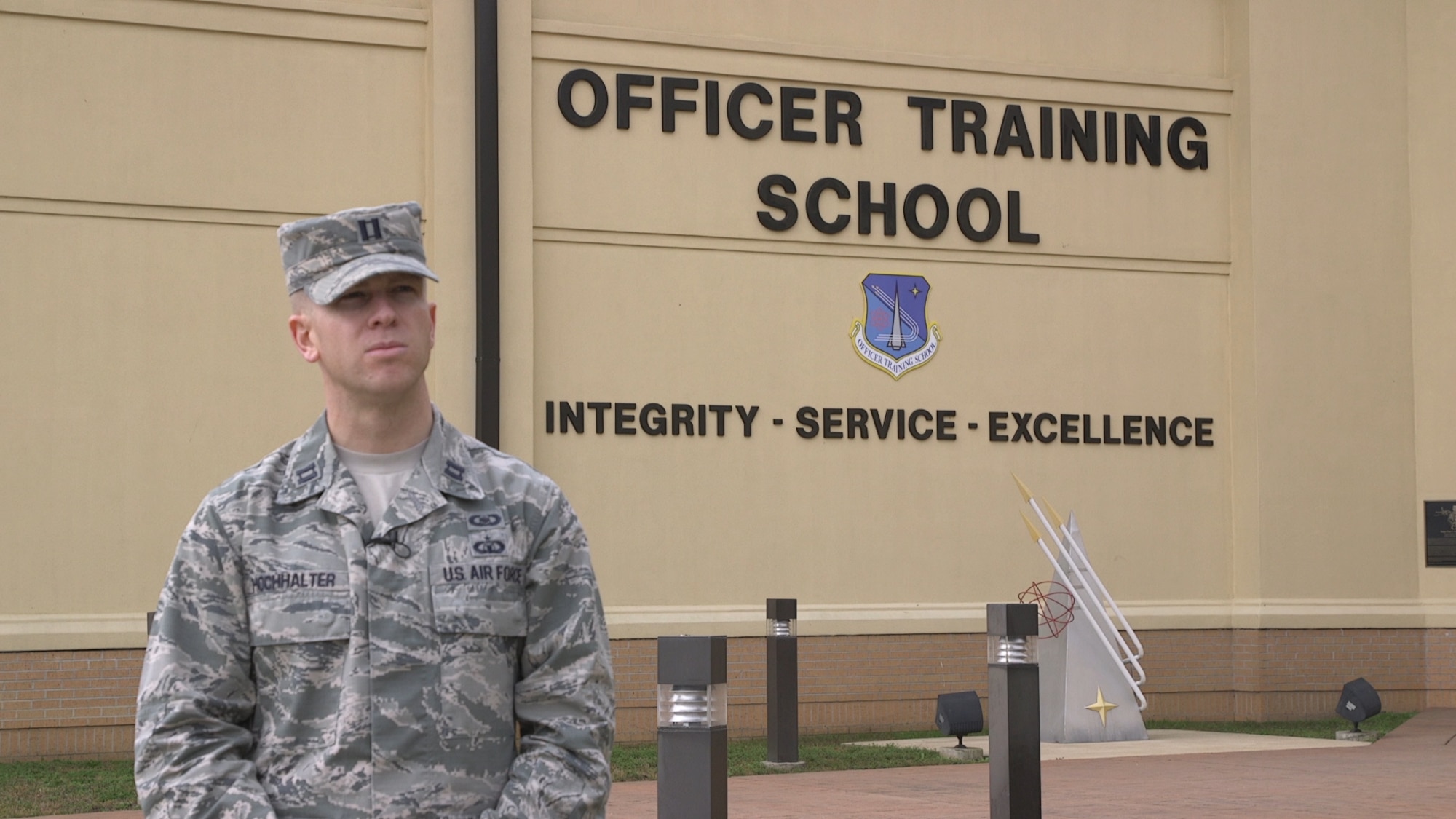 U.S. Air Force Capt. Dan Hochhalter, 24th Training Squadron member, stands  in front of the Officer Training School building on Maxwell Air Force Base, Alabama.
