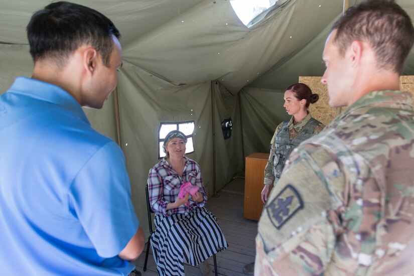Arizona Army National Guard soldiers with 1st Bn, 158th Infantry Regiment talk with a role player during training at Exercise Steppe Eagle 19 at Chilikemer Training Area near Almaty, Kazakhstan, June 24, 2019. Steppe Eagle 19 is an annual U.S. Army Central-led exercise that promotes regional stability and interoperability in the Central and South Asia region.
