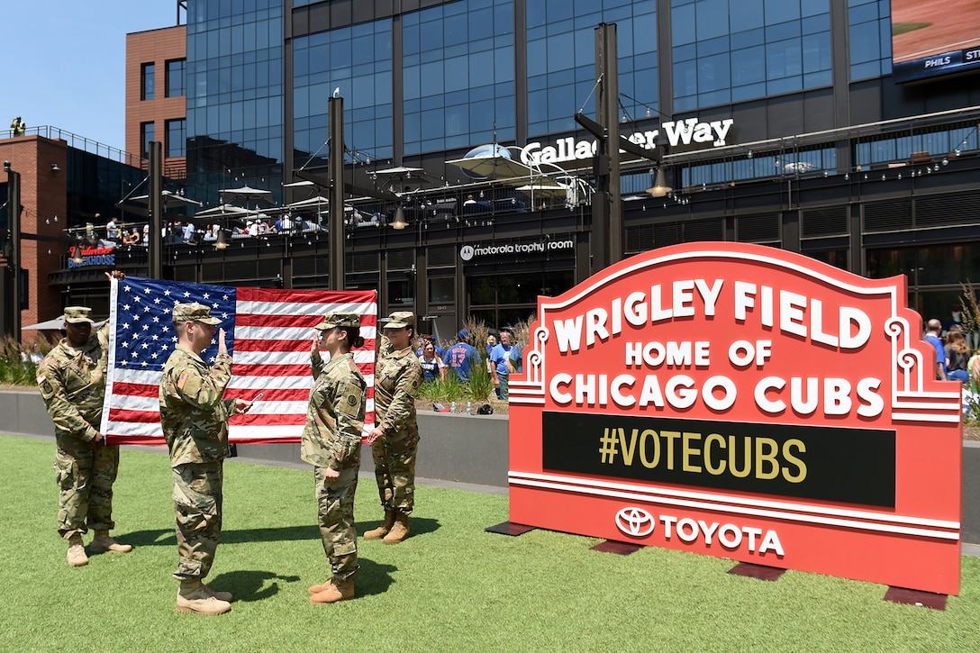 Sgt. Maribel Meraz, assigned to the 85th U.S. Army Reserve Support Command, headquartered in the northwest suburbs of Chicago, reenlists at Gallagher Way, adjacent to the Chicago Cubs Wrigley Field, June 27, 2019, for a third six-years in the Army Reserve.