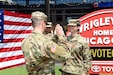 Sgt. Maribel Meraz, assigned to the 85th U.S. Army Reserve Support Command, headquartered in the northwest suburbs of Chicago, states the Oath of Enlistment at Gallagher Way, adjacent to the Chicago Cubs Wrigley Field, June 27, 2019, for a third six-years in the Army Reserve.