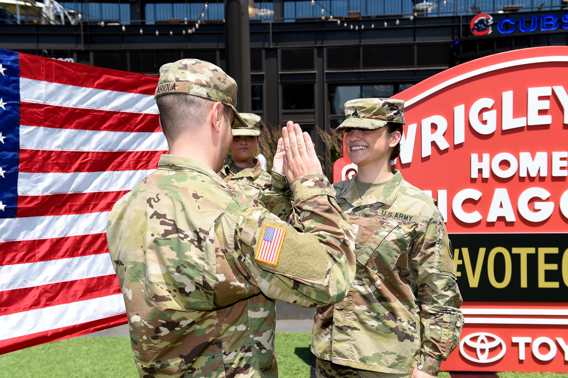 Sgt. Maribel Meraz, assigned to the 85th U.S. Army Reserve Support Command, headquartered in the northwest suburbs of Chicago, states the Oath of Enlistment at Gallagher Way, adjacent to the Chicago Cubs Wrigley Field, June 27, 2019, for a third six-years in the Army Reserve.