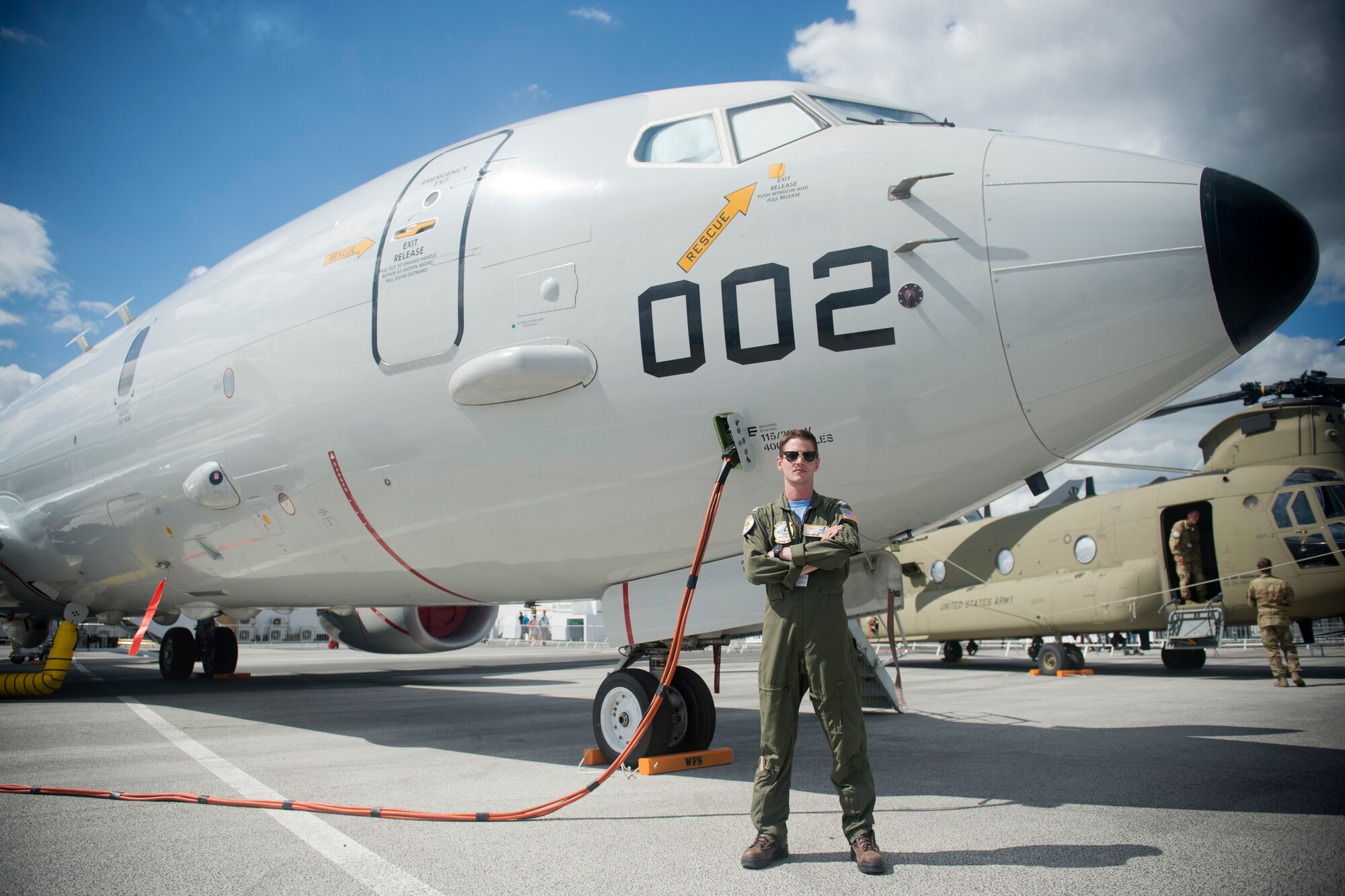 U.S. Navy Lt. Adam Anderson, a mission commander from Patrol Squadron 9, Combat Aircrew 3, stationed at Naval Air Station Whidbey Island, Wash., poses for a photo in front of a P-8A Poseidon from his unit at the Paris Air Show, June 21, 2019. Anderson was one of approximately 130 U.S. military aircrew and support personnel from bases in Europe and the U.S. who participated in the air show. (U.S. Air Force photo by Master Sgt. Eric Burks)