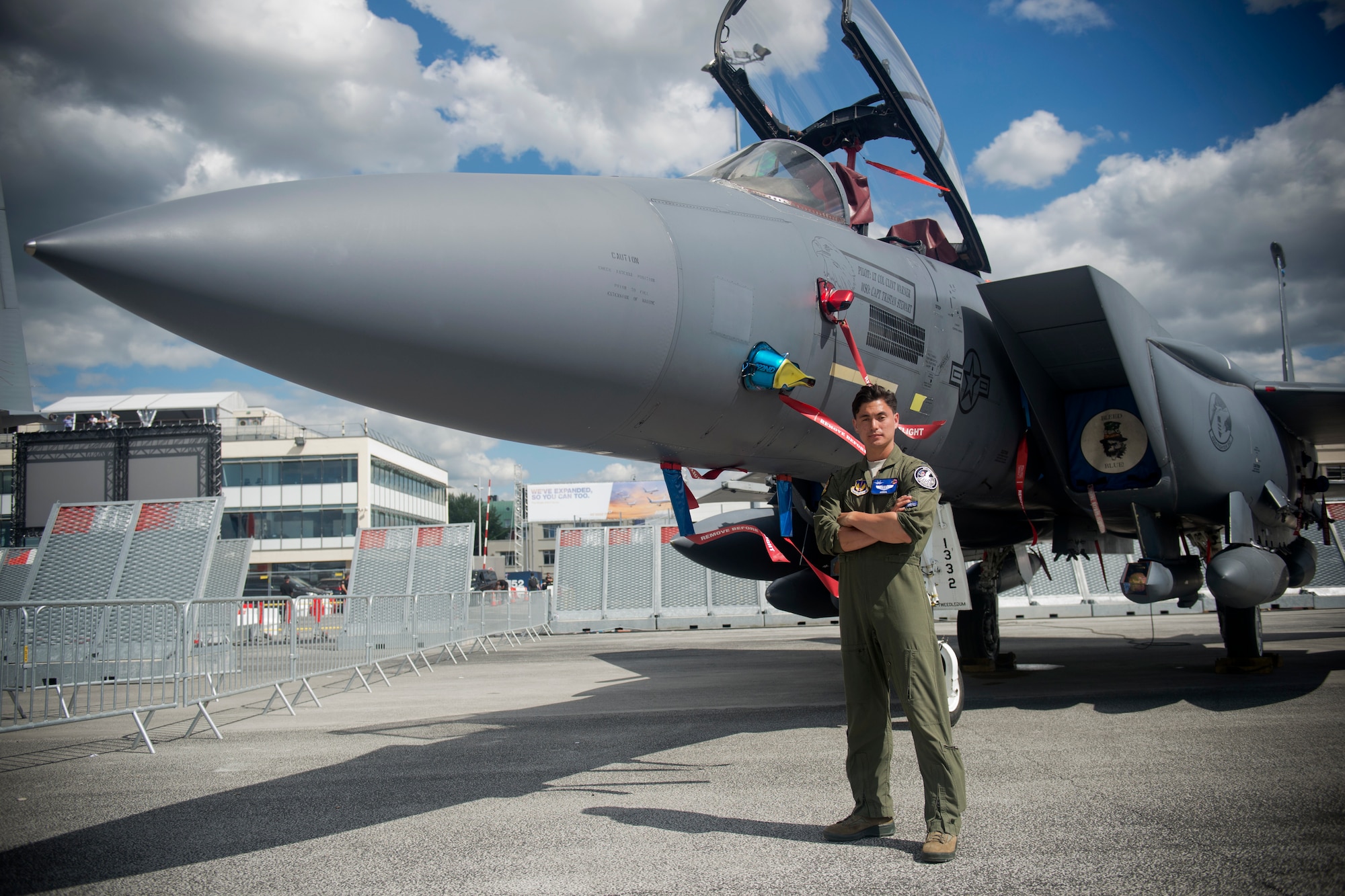 U.S. Air Force 1st Lt. Brandon "Animal" Shelley, a 492nd Fighter Squadron weapon systems officer from the 48th Fighter Wing at Royal Air Force Lakenheath, England, poses for a photo in front of an F-15E Strike Eagle from his squadron at the Paris Air Show, June 21, 2019. Other Department of Defense aircraft showcased during the air show included the K-46A Pegasus, F-35A Lightning II, C-130J Super Hercules, P-8 Poseidon, CH-47 Chinook, and AH-64 Apache. (U.S. Air Force photo by Master Sgt. Eric Burks)
