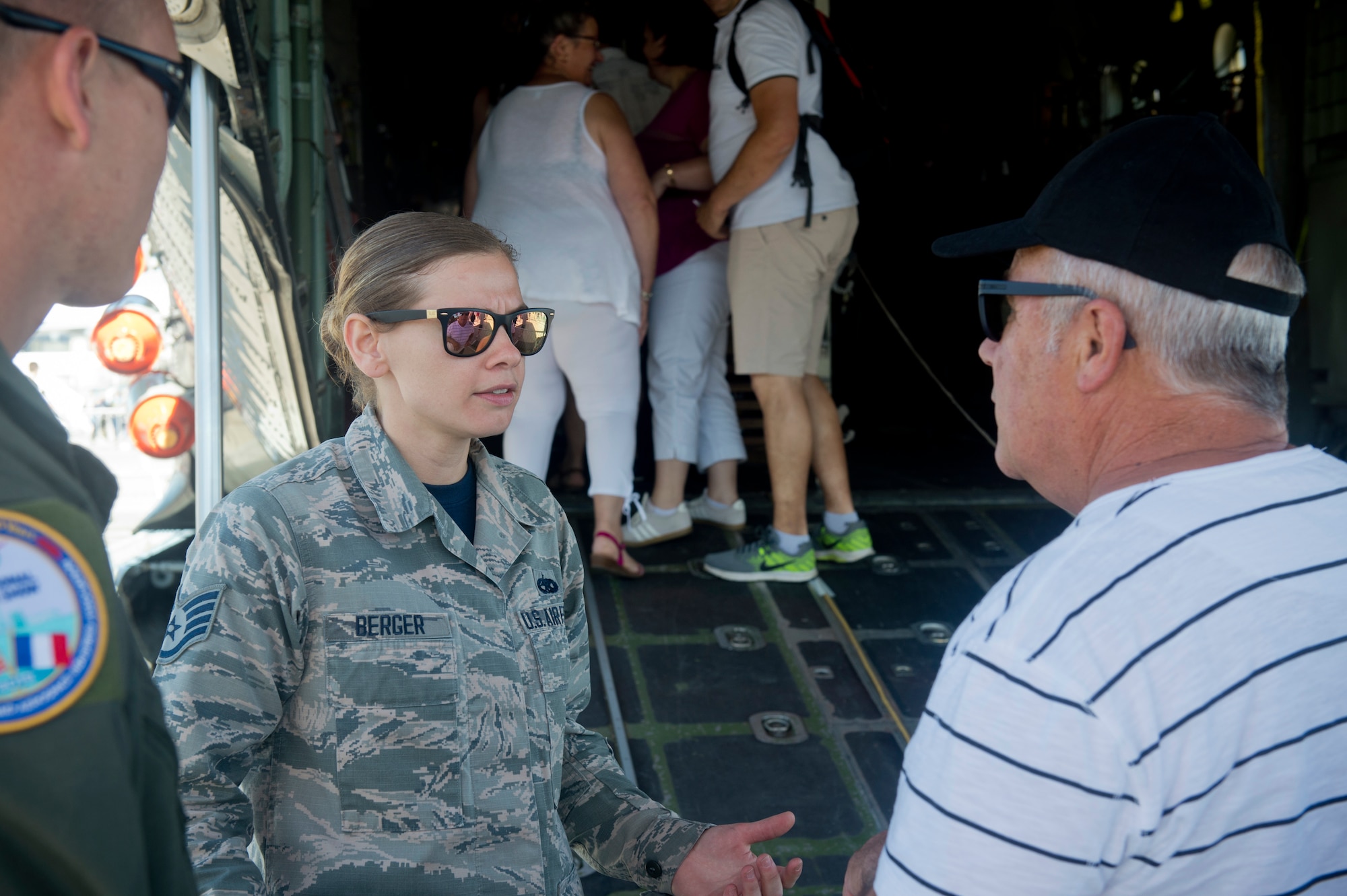 U.S. Air National Guard Staff Sgt. Jennatte Berger, an avionics technician from the 109th Airlift Wing at Stratton Air National Guard Base in Scotia, N.Y., engages with visitors during the Paris Air Show, June 22, 2019. The air show provided a collaborative opportunity to share and strengthen U.S. and strategic international partnerships. (U.S. Air Force photo by Master Sgt. Eric Burks)