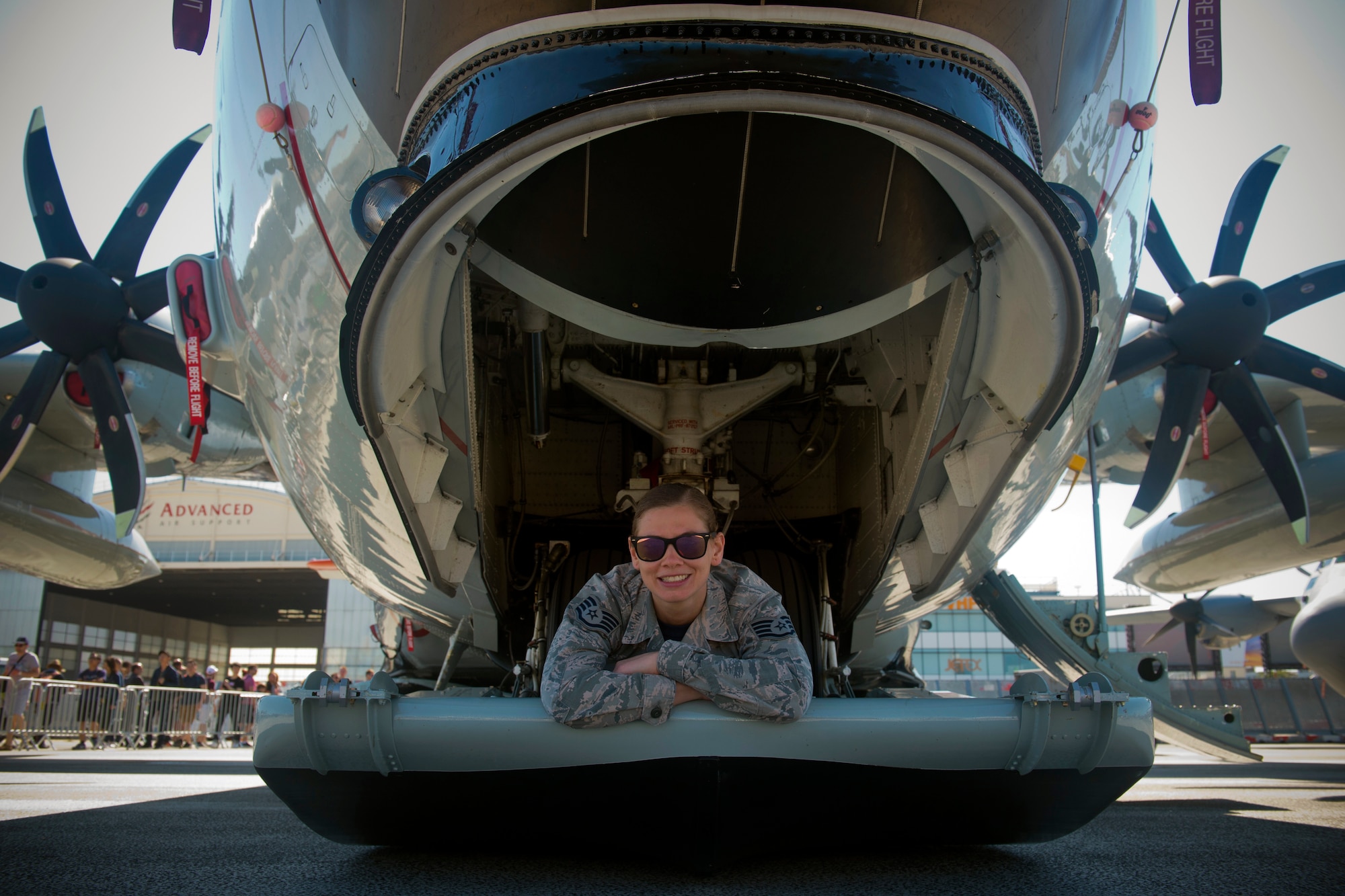 U.S. Air National Guard Staff Sgt. Jennatte Berger, an avionics technician from the 109th Airlift Wing at Stratton Air National Guard Base in Scotia, N.Y., poses for a photo on the skis of an LC-130 Hercules "Skibird" from her unit at the Paris Air Show, June 22, 2019. This year was the first time the 109th AW, or any New York Air National Guard contingent, had participated in the Paris Air Show. (U.S. Air Force photo by Master Sgt. Eric Burks)
