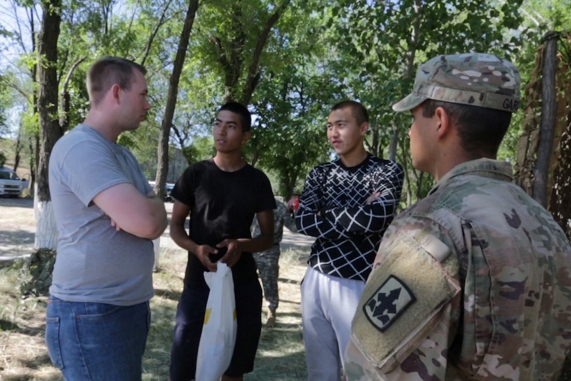 Spc. Levi Madsen (far left), Utah Army National Guard, interprets for a soldier at Exercise Steppe Eagle 19 at Chilikemer Training Area near Almaty, Kazakhstan, June 25, 2019. Kazakhstan, the United States, the United Kingdom, Tajikistan, and Kyrgyzstan all sent participants for the exercise, while India, Turkey, and Uzbekistan sent observers. Steppe Eagle 19 is an annual U.S. Army Central-led exercise that promotes regional stability and interoperability in the Central and South Asia region.