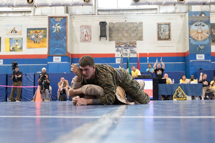 United States Marine Capt. Dylan Grayston, an assistant air officer assigned to the 11th Marine Expeditionary Unit, wins a heavy weight fight during a combatives tournament at Camp Arifjan, Kuwait, June 23, 2019. U.S. Army Central hosts events such as the combatives tournament to strengthen its relationship and build partner capacity with the Kuwaitis. USARCENT operates throughout the Middle East region and appreciates the generosity of the host nation’s willingness to maintain bilateral defense relationships.