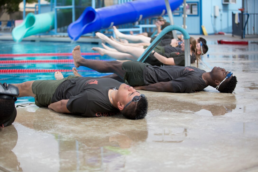 U.S. Marines Stationed at Marine Corps Air Station Yuma conduct physical training as part of their corporals course curriculum at MCAS Yuma Ariz., June 13, 2019. Corporals Course is a professional education leadership course designed to teach Marines the fundamentals of being a noncommissioned officer and their responsibilities as the backbone of the Marine Corps. (U.S. Marine Corps photo by Cpl. Joel Soriano)