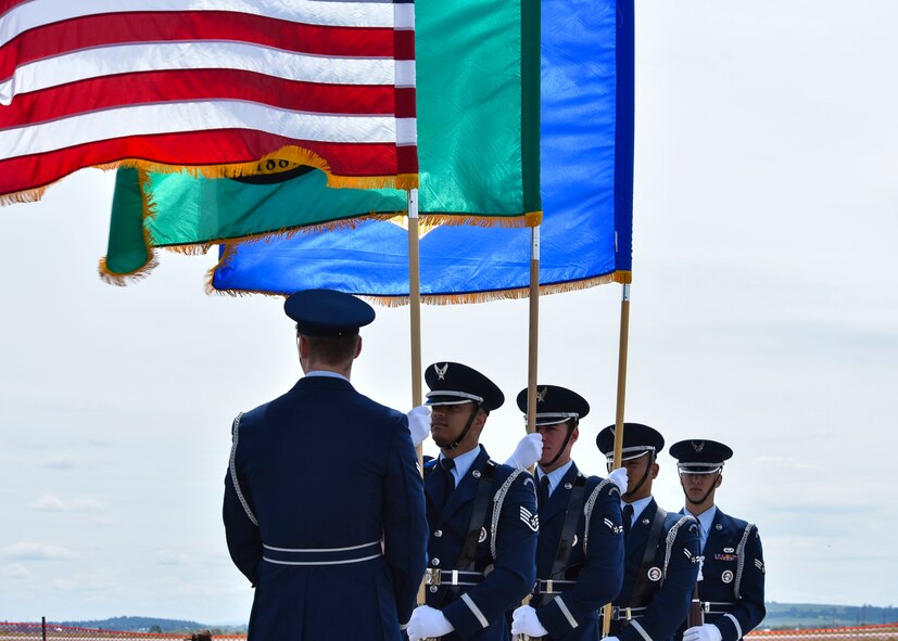 Honor Guard members wait to post colors