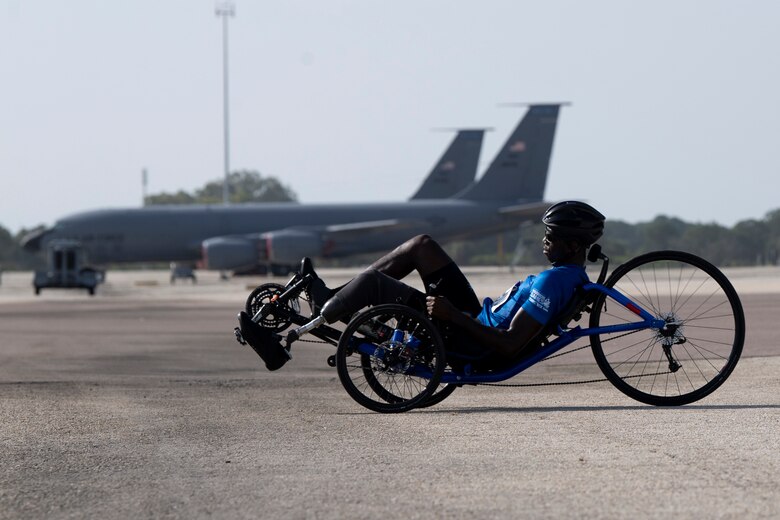 Air Force Staff Sgt. races a recumbent cycle during the 2019 DoD Warrior Games