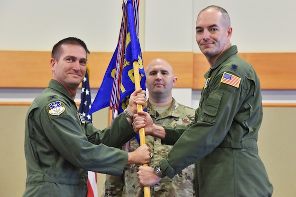 Lt. Col. Daniel Bunch, right, accepts command of the 341st Operations Support Squadron from Col. Christopher Menuey, 341st Operations Group commander, during a change of command ceremony June 28, 2019, at Malmstrom Air Force Base, Montana.