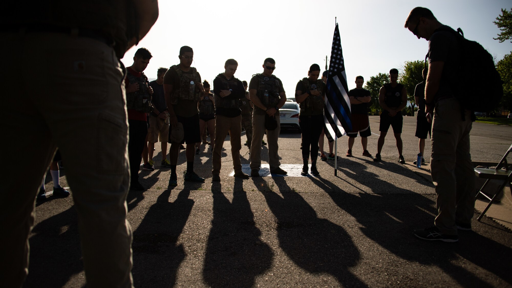 Participants during the 12th Annual Balmer Ruck March observe a moment of silence June 7, 2019, at Hill Air Force Base, Utah. The event is held each year to honor Special Agent Ryan Balmer who was killed in action June 5, 2007, at Kirkuk Iraq. Balmer was a member of the AFOSI Detachment 113 at Hill AFB. (U.S. Air Force photo by R. Nial Bradshaw)