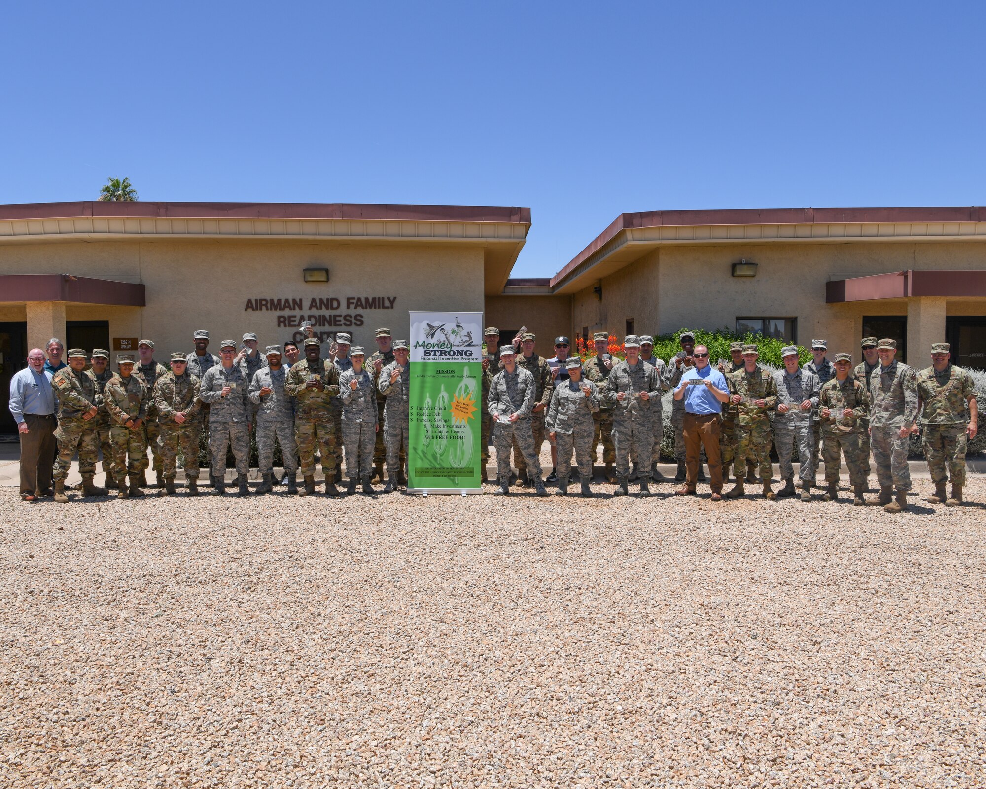Luke leadership, along with participants of the Money Strong Financial Incentive Program, pose for a group photo June 24, 2019, at Luke Air Force Base, Ariz.