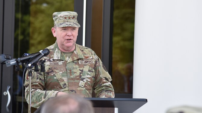 Lt. Gen. Richard Scobee, commander of Air Force Reserve Command, speaks during a ribbon cutting ceremony celebrating the completion of phase one of the consolidated mission complex June 25, on Robins Air Force Base in Georgia. Once completed the three-phase project will bring together 965 employees who are currently separated in nine different facilities. (U.S. Air Force photo by Misuzu Allen)