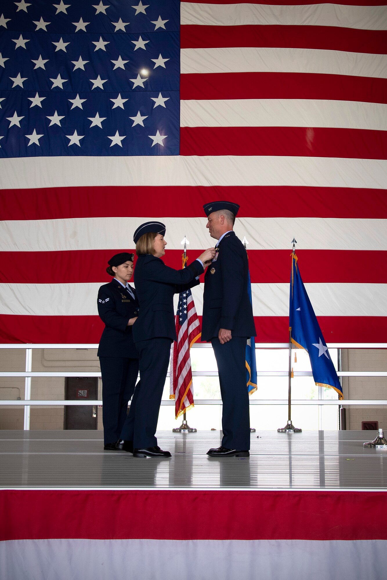Col. Benjamin Spencer, 319th Air Base Wing commander, receives the Legion of Merit from Maj. Gen. Mary O’Brian, 25th Air Force commander, during a change of command ceremony June 28, 2019, on Grand Forks Air Force Base, North Dakota.