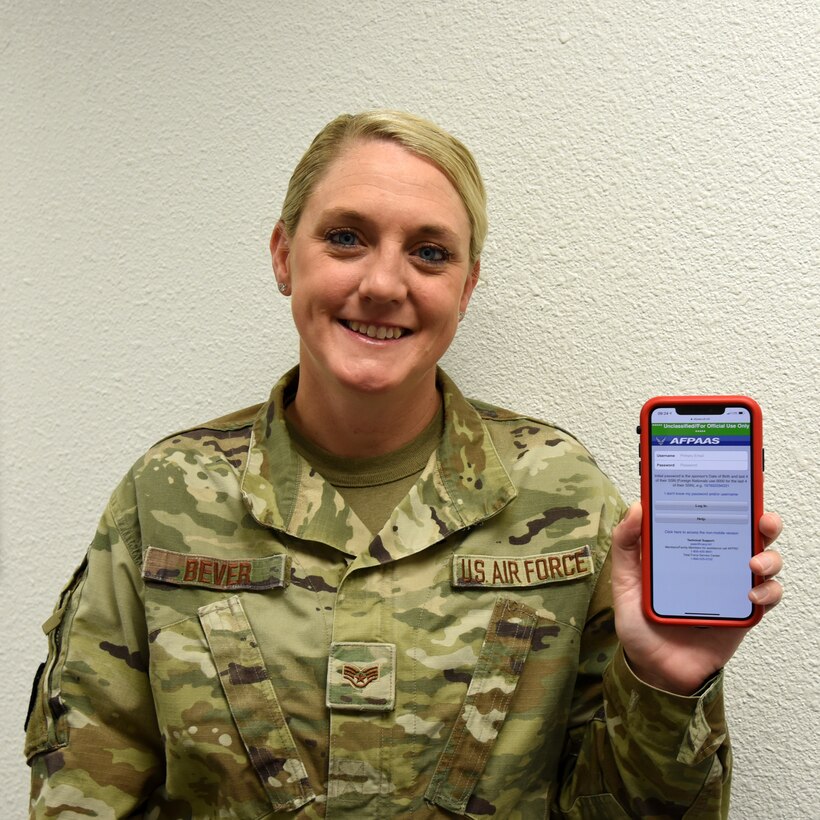Staff Sgt. Ashley Bever, 403rd Force Support Squadron Non Commissioned Officer in charge of Installation Personnel Readiness, displays the Air Force Personnel Accountability and Assessment System, aka AFPAAS, website on a mobile phone June 28, 2019 at Keesler Air Force Base, Mississippi. AFPAAS is a notification system designed to inform Airmen and their families who are directly affected by major emergencies, such as hurricanes, fires, floods, earthquakes and evacuations due to these natural disasters or crisis events. (U.S. Air Force photo by Tech. Sgt. Christopher Carranza)