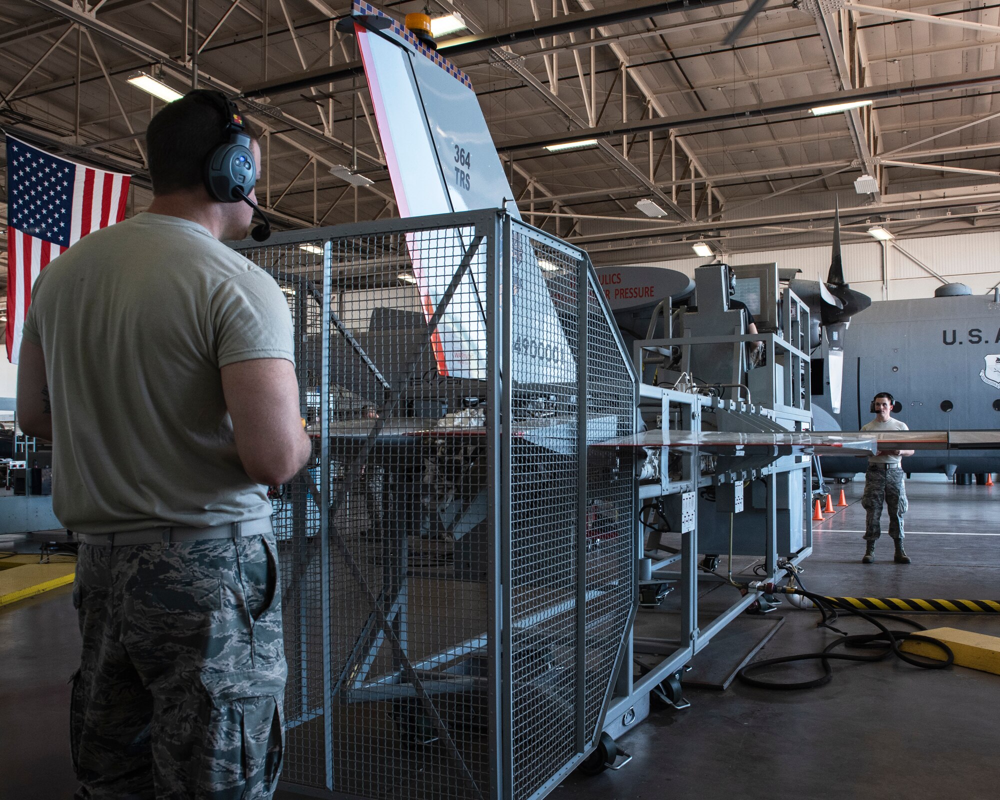 Airman Brice Vulgamore, left, Airman 1st Class Kyle Jaycox, in seat, and Airman 1st Class Matthew Higgs, 364th Training Squadron hydraulic systems apprentice course students, troubleshoot the hydraulics systems in a flight control simulator at Sheppard Air Force Base, Texas, June 28, 2019. Higgs plays the role of operations checks director and reads instructions for Jaycox to flip the switches in the flightdeck as Vulgamore makes sure the system responds correctly. (U.S. Air Force photo by Airman1st Class Pedro Tenorio