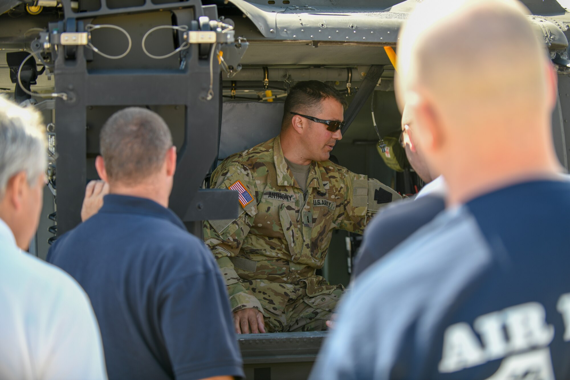 Chief Warrant Officer 3 Greg Anthony, a UH-60 Black Hawk helicopter pilot assigned to 1-230th Assault Helicopter Battalion out of Johnstown, Pennsylvania discusses emergency procedures with firefighters from the 910th Civil Engineer Fire Department here, June 26, 2019.