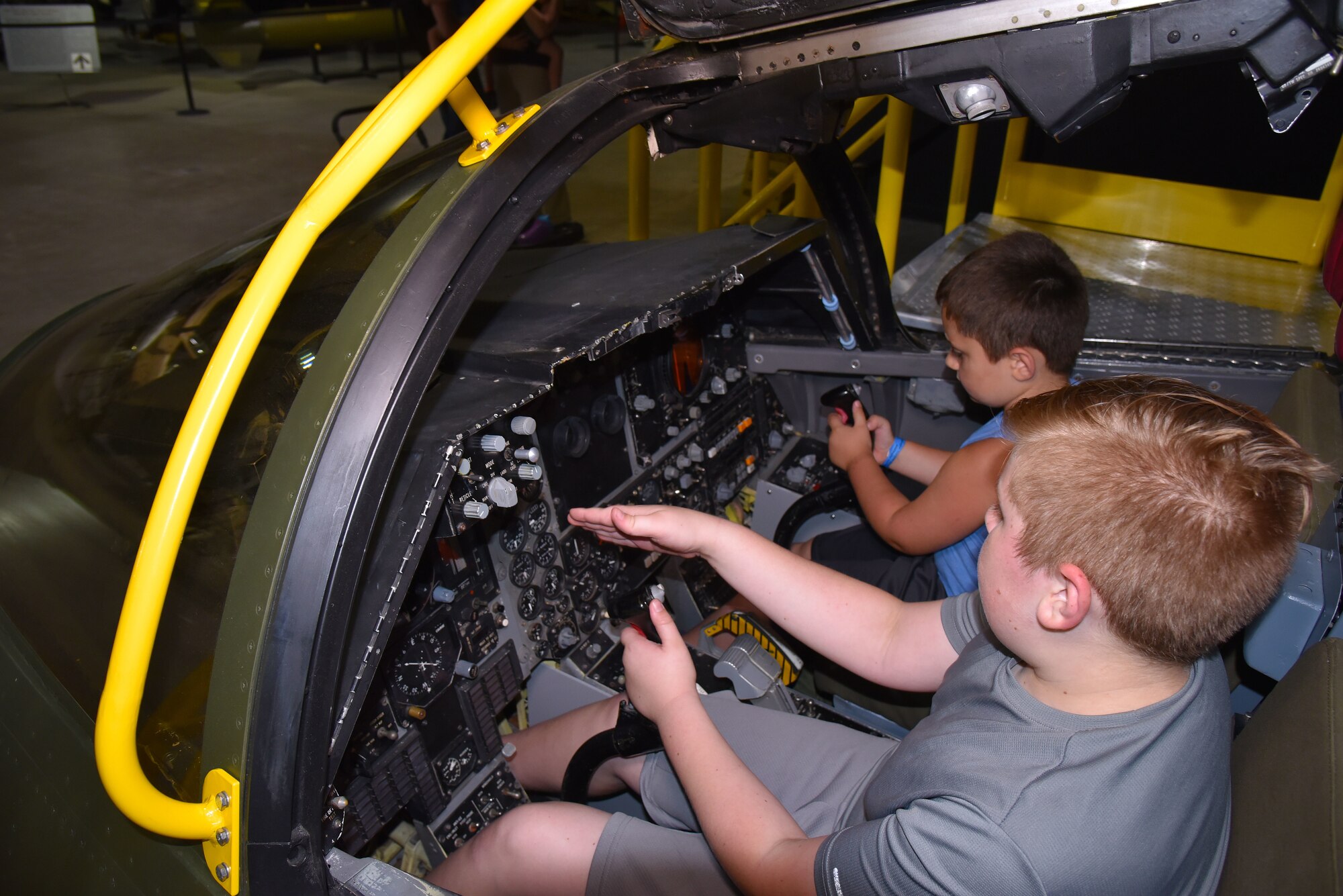 DAYTON, Ohio - Museum visitors enjoying the FB-111A Sit-in Cockpit in the Cold War Gallery at the National Museum of the U.S. Air Force. (U.S. Air Force photo)