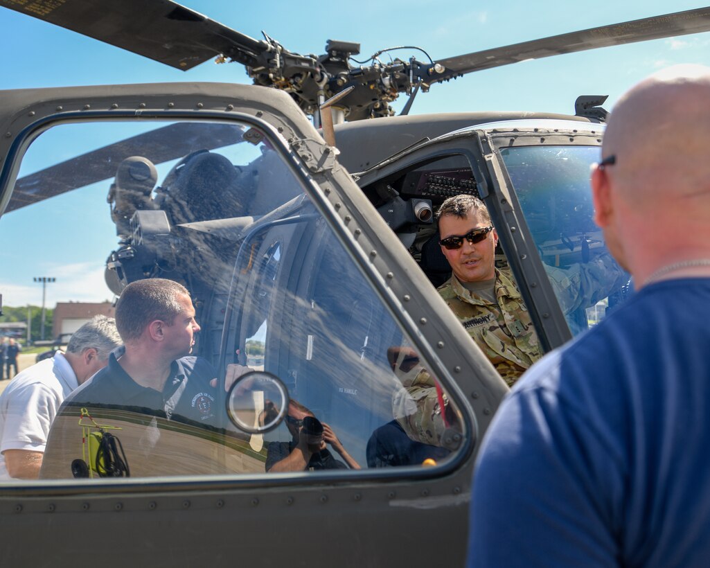 Chief Warrant Officer 3 Gregory Anthony, a UH-60 Black Hawk helicopter pilot assigned to the 1-230th Assault
Helicopter Battalion out of Johnstown, Pennsylvania, discusses emergency procedures with firefighters from the 910th Civil Engineer Fire Department here, June 26, 2019.
