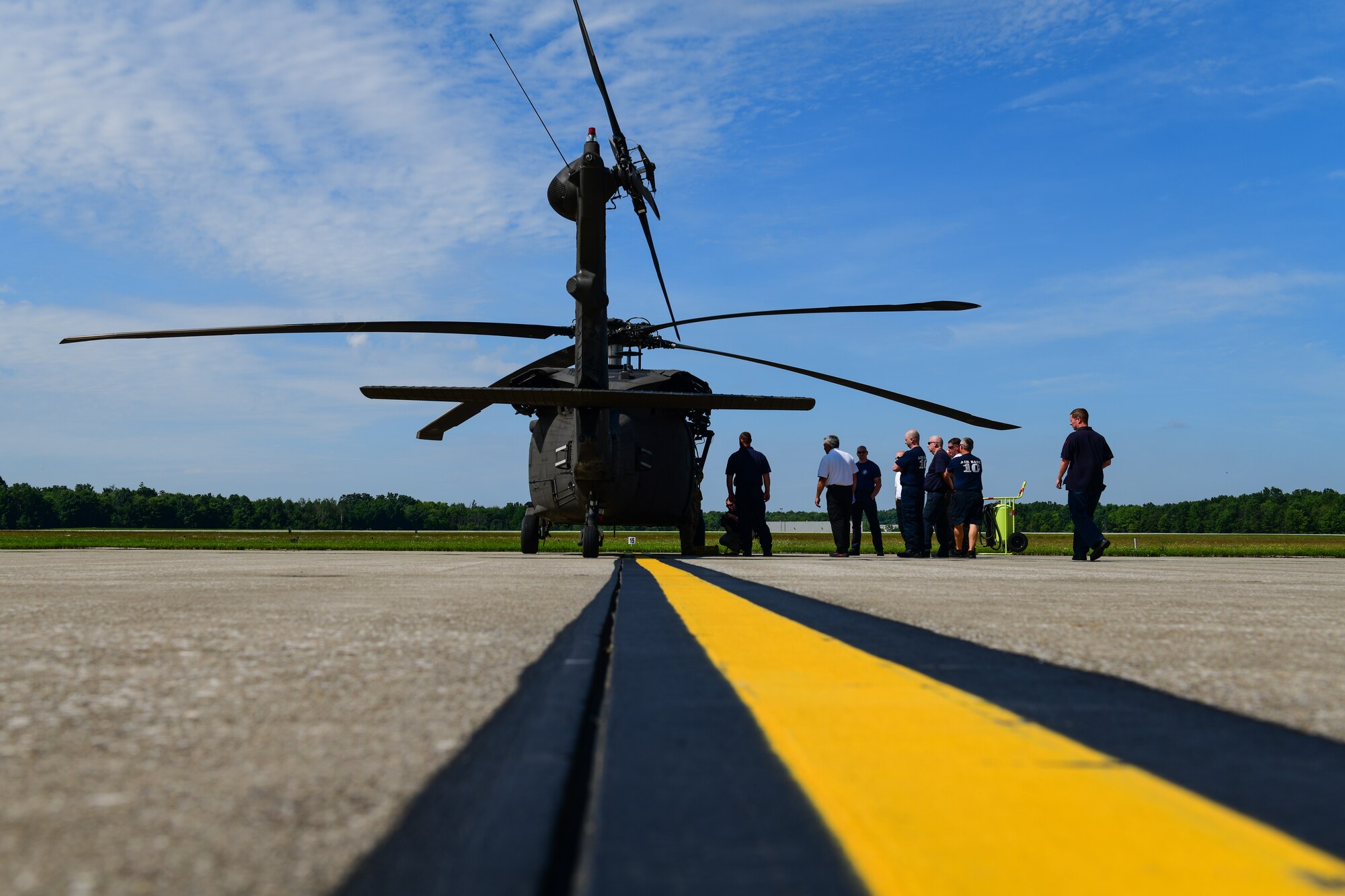 Youngstown Air Reserve Station firefighters receive training on engine shut-down procedures, emergency crew extraction and other safety concerns on the UH-60 Black Hawk helicopter on the aircraft ramp here June 26, 2019.