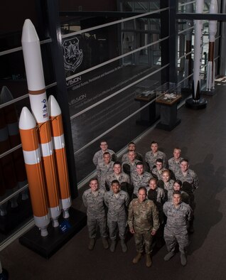 Maj. Gen. John Shaw, Air Force Space Command deputy commander (front center), stands with Reserve Officer Training Corps cadets during the inaugural AFROTC space immersion program, June 4, 2019, at Headquarters AFSPC. The program teaches cadets about AFSPC’s space warfighting capabilities and provides opportunities for leadership development and mentorship. (U.S. Air Force photo by David Grim)