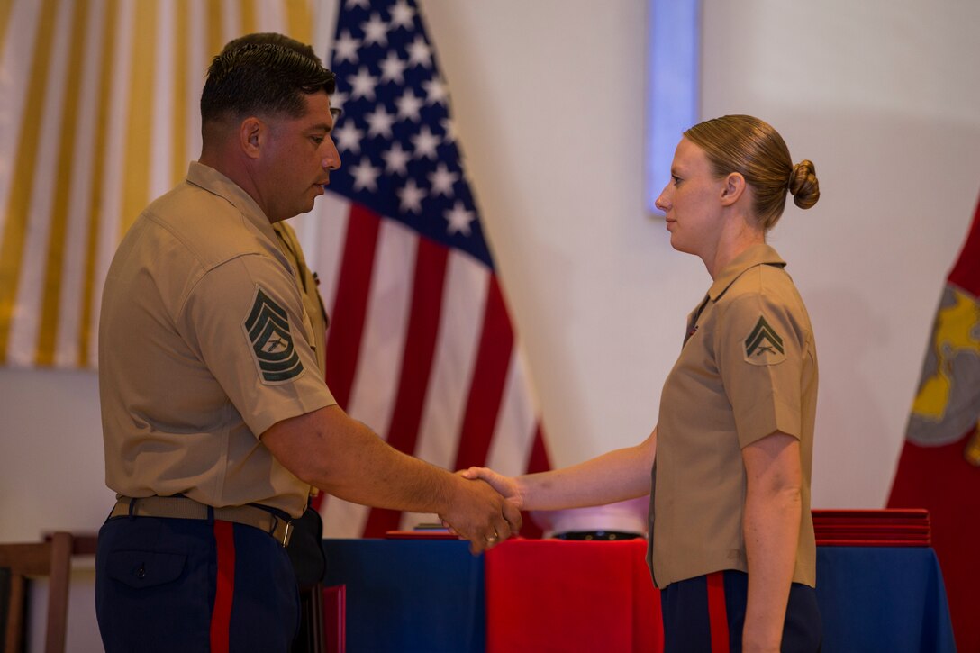 U.S. Marines stationed at Marine Corps Air Station (MCAS) Yuma graduate from Corporals Course 6-19 at the station chapel on MCAS Yuma, Ariz., June 21, 2019. Corporals Course is a 3-week long professional military education class designed to teach Marine Corporals the fundamentals of being a noncommissioned officer and the leadership skills necessary to lead Marines. (U.S. Marine Corps photo by Lance Cpl. John Hall)