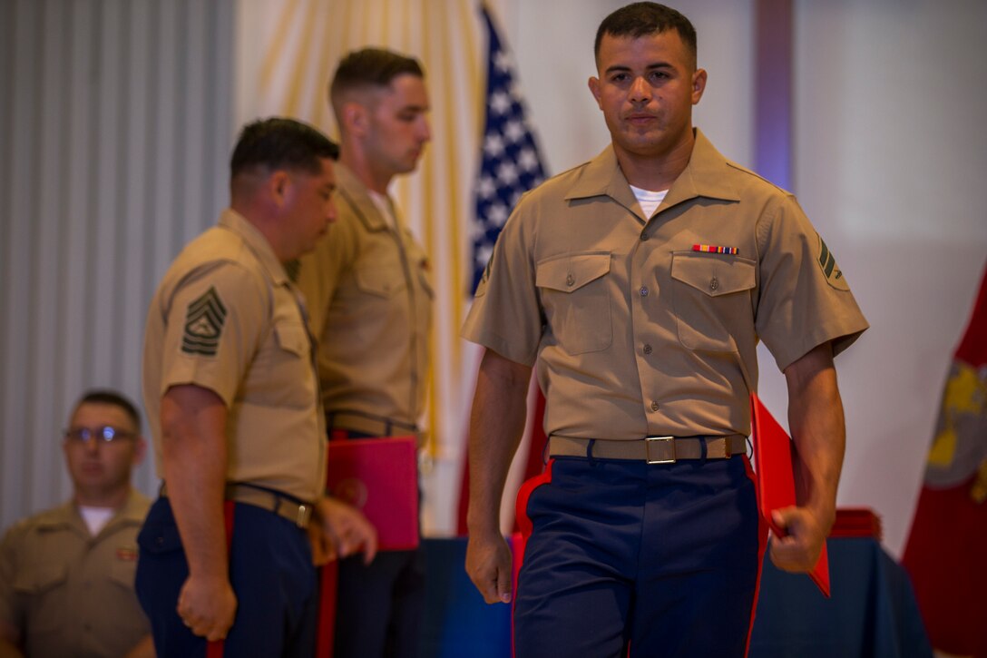 U.S. Marines stationed at Marine Corps Air Station (MCAS) Yuma graduate from Corporals Course 6-19 at the station chapel on MCAS Yuma, Ariz., June 21, 2019. Corporals Course is a 3-week long professional military education class designed to teach Marine Corporals the fundamentals of being a noncommissioned officer and the leadership skills necessary to lead Marines. (U.S. Marine Corps photo by Lance Cpl. John Hall)