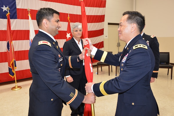 Maj. Gen. Mark Toy (Right), U.S. Army Corps of Engineers Great Lakes and Ohio River Division commander, passes the Corps of Engineers flag to Lt. Col. Sonny B. Avichal as he took command of the Nashville District during a change of command ceremony June 28, 2019 at the Tennessee National Guard Armory in Nashville, Tenn. (USACE photo by Mark Rankin)