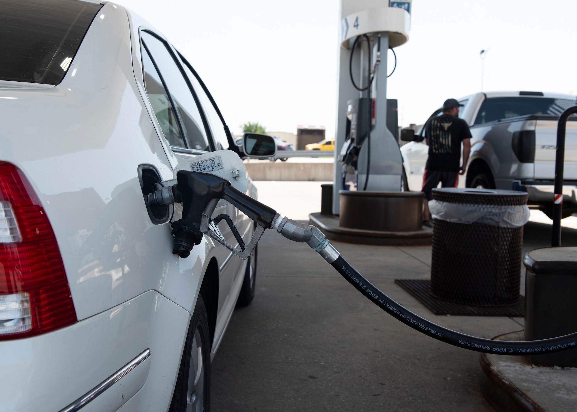 Members of Whiteman Air Force Base, Missouri, pump gas at the AAFES shoppette on June 28, 2019. The gas station now featured extender hoses, which are designed to reach to the opposite side of a vehicle, allowing drivers to fill up while adhering to the one-way flow traffic rules. (U.S. Air Force photo by Staff Sgt. Kayla White)