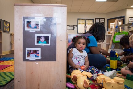 Tonya Smith, 502nd Force Support Squadron, child development program lead technician, plays games with toddlers, June 11, 2019, at the Gateway Child Development Center, Joint Base San Antonio-Lackland, Texas.