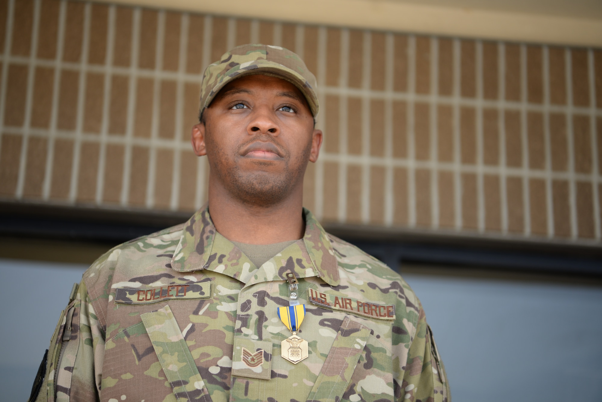 U.S. Air Force Tech. Sgt. Jonathan Collett, 336th Training Squadron cyber surety student, stands after being awarded an Air Force Commedation Medal outside the Levitow Training Support Facillity on Keesler Air Force Base, Mississippi, June 27, 2019. A ceremony was held for Collett due to his heroic actions after rescuing Dennis Boney, Harrison County Police Department deputy. (U.S Air Force photo by Airman 1st Class Spencer Tobler)