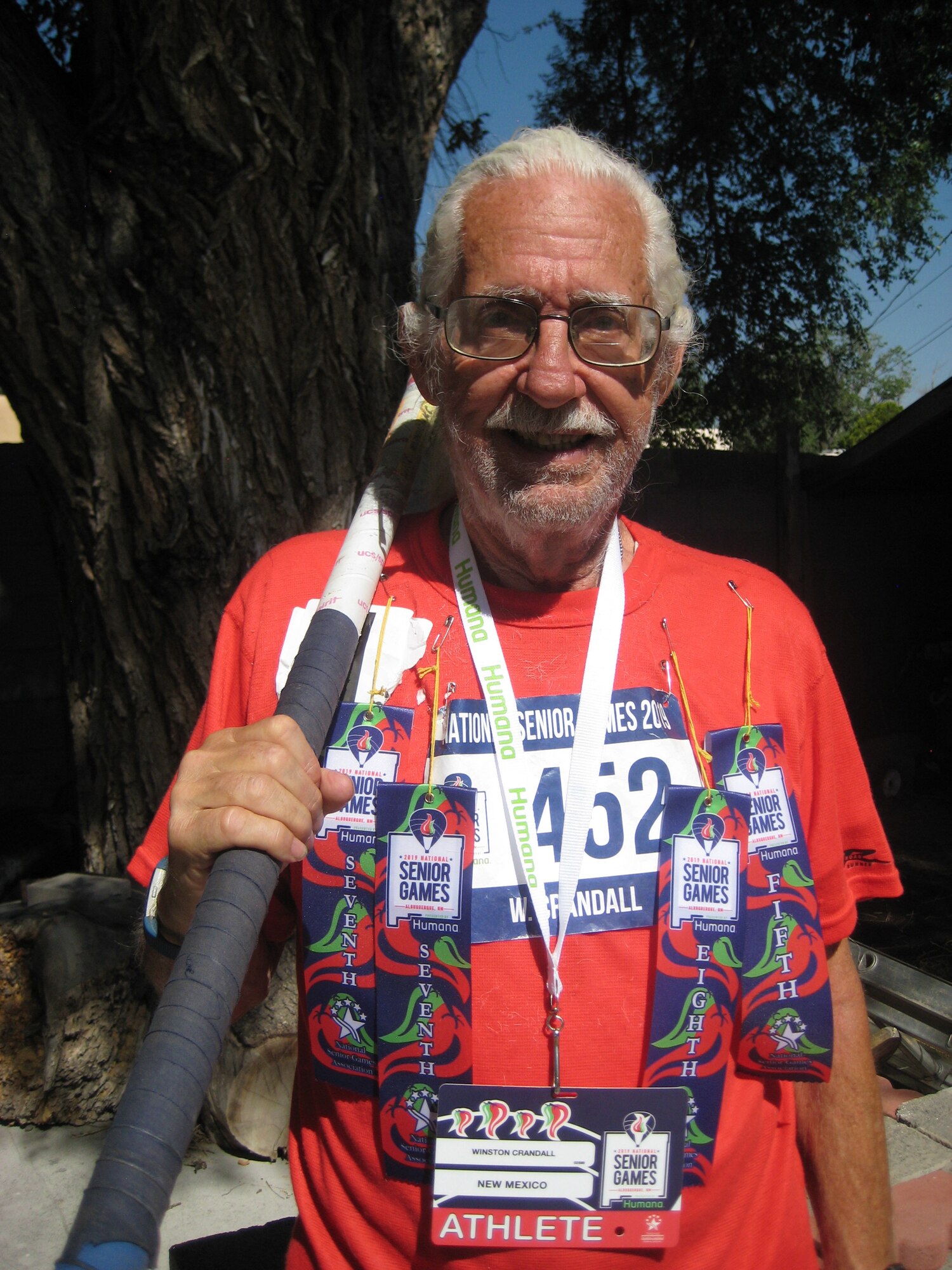 Retired Lt. Col. and former Team Kirtland member Winston Crandall displays his decorations for top-10 finishes at the National Senior Games June 22. The games, taking place in the Duke City from June 14 to 25, feature competition for people over 50 in 20 different sports. Many veterans and Albuquerque residents are taking part in the games, which have featured more than 13,700 athletes participating. Crandall, who served at Phillps Lab (now Air Force Research Laboratory New Mexico) toward the end of his Air Force career—he retired in 1992—has been an Albuquerque resident ever since. He competed and placed in the top 10 in the 75-79 age category in the Pole Vault, Men’s 5,000- and 1,500-meter Race Walk, and Powerwalk. (Courtesy photo)