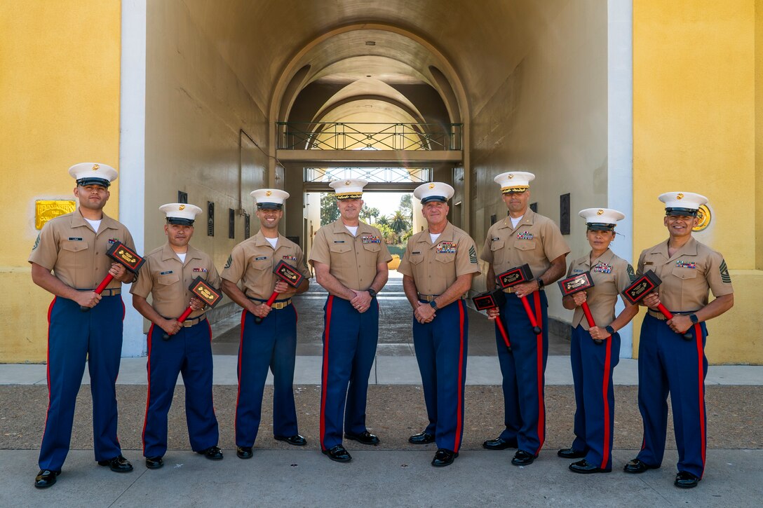 U.S. Marines assigned to 12th Marine Corps District, Western Recruiting Region, pose for a photo after a recognition ceremony at Marine Corps Recruit Depot San Diego, Calif., June 28, 2019. The ceremony was held to recognize Marines who made an impact in their respective recruiting districts. (U.S. Marine Corps photo by Sgt. Christian Cachola)