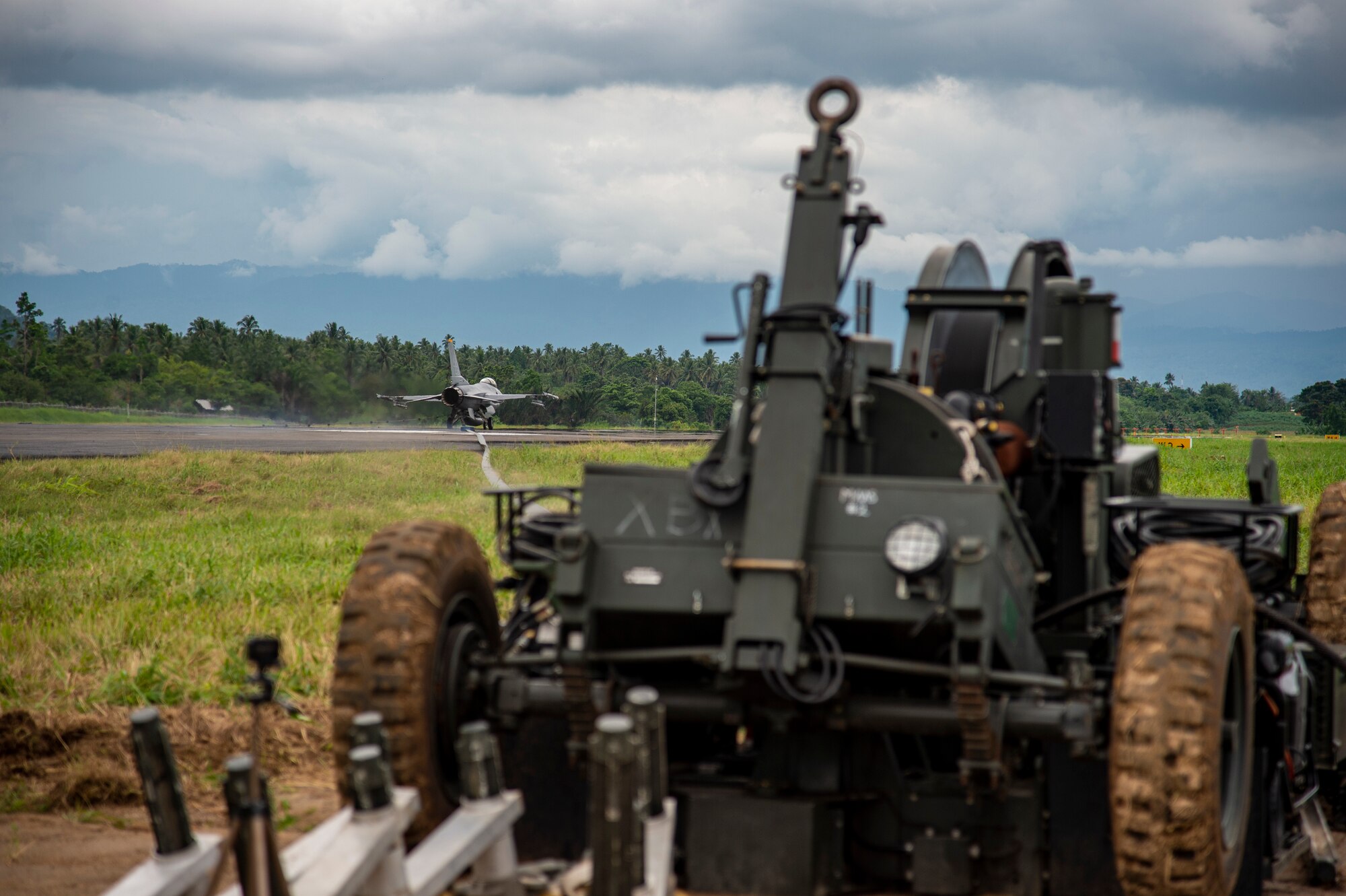 A U.S. Air Force F-16 Fighting Falcon from the 14 Fighter Squadron, Misawa Air Base, Japan, comes to a stop after hooking onto the mobile aircraft arresting system (MAAS) at the Sam Ratulangi International Airport, Manado, Indonesia, June 17, 2019. The MAAS is a contingency airfield asset that allows for the safe retrieval of tail hook aircraft during an in-flight emergency. It is air-portable and can be installed in a variety of methods and on practically any surface type to provide coverage in a variety of scenarios. (U.S. Air Force photo by Staff Sgt. Melanie A. Hutto)