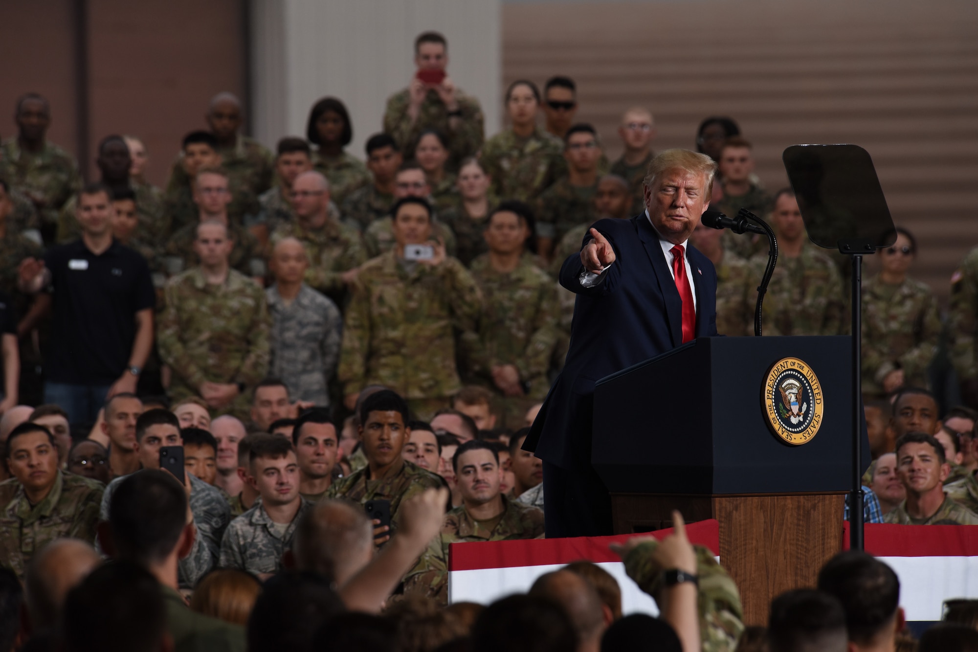 President Donald J. Trump addresses service members and their families during an event at Osan Air Base, Republic of Korea, June 30, 2019. U.S. Forces Korea supports a wide array of joint and combined operations giving service members regular training interactions with others services and multi-national forces. (U.S. Air Force photo by Staff Sgt. Sergio A. Gamboa)