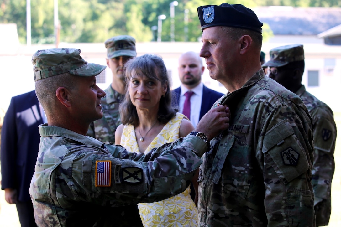 KAISERSLAUTERN, Germany – U.S. Army Reserve Brig. Gen. Michael T. Harvey, incoming commander of the 7th Mission Support Command, addresses Soldiers and guests during a change of command ceremony held on NCO Field at Daenner Kaserne, United States Army Garrison Rheinland-Pfalz, June 29, 2019.