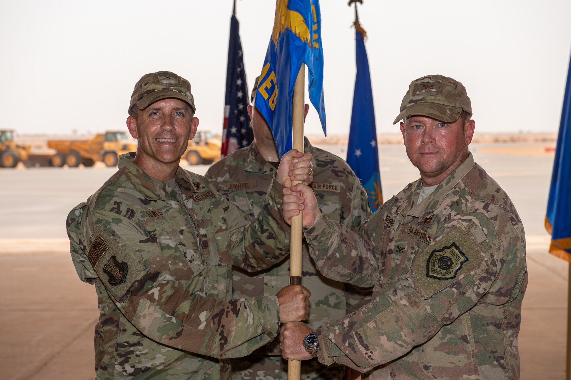 U.S. Air Force Col. Steven P. Bording, right, relinquishes command of the 409th Air Expeditionary Group with Brig. Gen. Michael T. Rawls, 435th Air Ground Operations Wing and 435th Air Expeditionary Wing commander, at Air Base 201, Niger, June 28, 2019. The 409th AEG is responsible for providing operations and integrated base operating support at three locations as part of the U.S. Africa Command counter-terrorism campaign in North and West Africa. (U.S. Air Force photo by Staff Sgt. Devin Boyer)