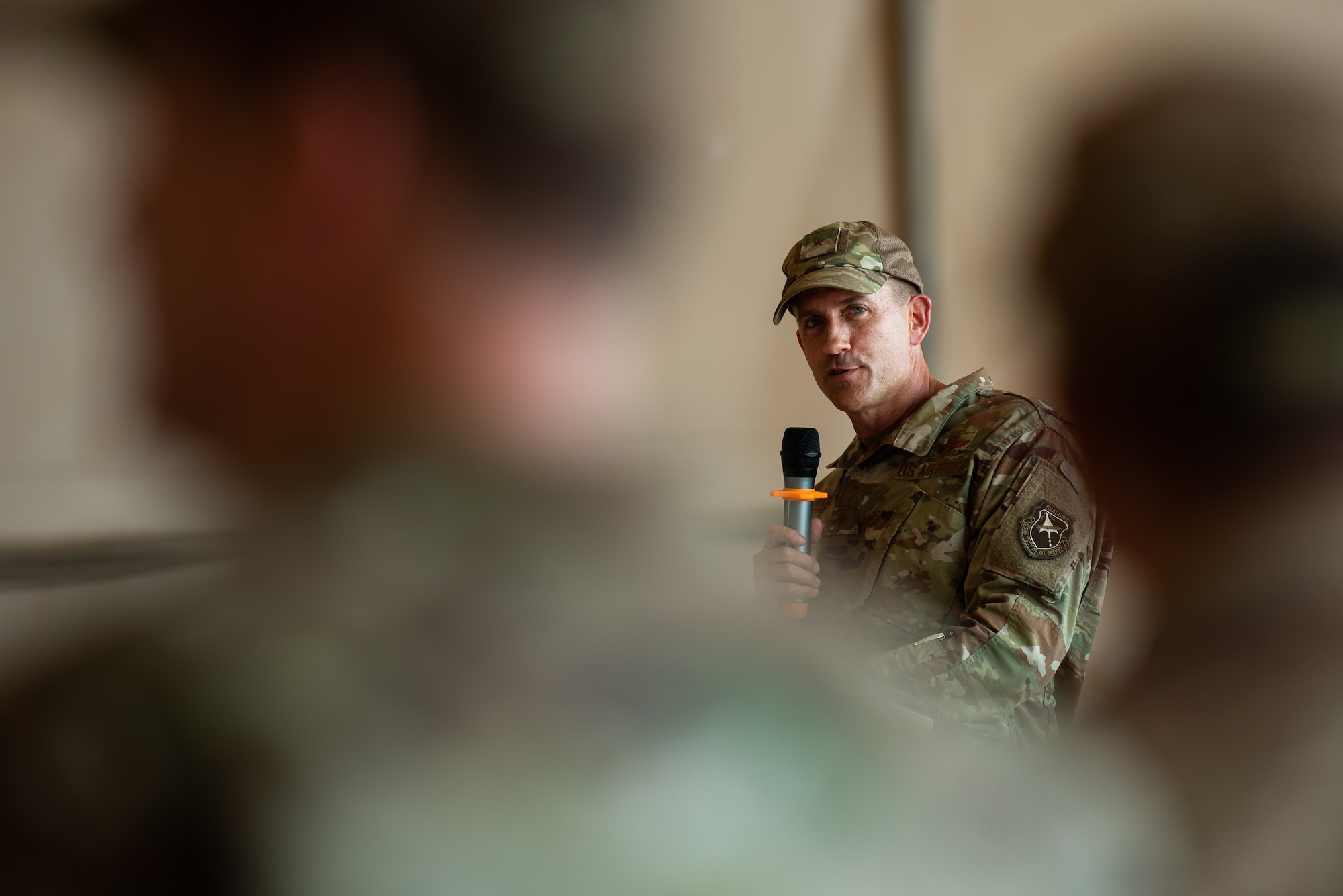 U.S. Air Force Brig. Gen. Michael T. Rawls, 435th Air Ground Operations Wing and 435th Air Expeditionary Wing commander, gives a speech during the 409th Air Expeditionary Group change of command ceremony at Air Base 201, Niger, June 28, 2019. Rawls spoke about the tremendous accomplishments and hurdles the commanders and their Airmen overcame to keep the base running in an austere environment. (U.S. Air Force photo by Staff Sgt. Devin Boyer)