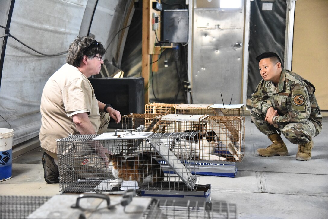 Tech. Sgt. Terence Park, 380th Expeditionary Civil Engineer Squadron pest management journeyman, speaks to Christie Heiser, Area Support Group Kuwait Camp Arifjan clinic manager, at Al Dhafra Air Base, United Arab Emirates, Feb. 18, 2019. Pest management Airmen have multiple capabilities ranging from keeping bases free of pests that could carry debilitating infectious diseases to repelling birds from airfields to ensure safe takeoff and landings, protecting the health and safety of everyone on base. (U.S. Air Force photo by Senior Airman Mya M. Crosby)