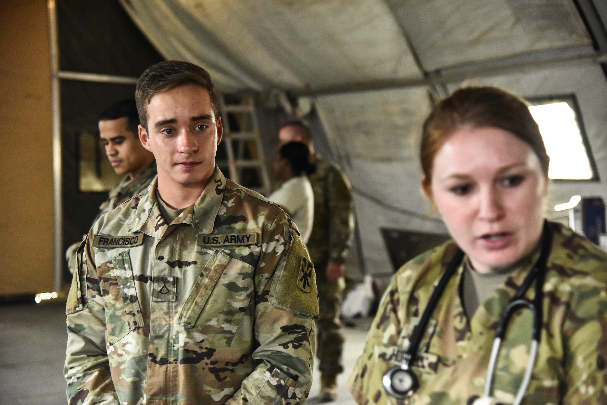Army Private First Class Nolean Francisco, 1-43 Air Defense Artillery combat medic, attends hands-on training during a Trap-Neuter-Vaccinate-Return initiative at Al Dhafra Air Base, United Arab Emirates, Feb. 20, 2019. The 380th Expeditionary Civil Engineer Squadron pest management team, the 380th Expeditionary Medical Group public health team and the veterinary staff at Camp Arifjan, Kuwait, worked together on an initiative to neuter, spay and vaccinate wild cats at ADAB. (U.S. Air Force photo by Senior Airman Mya M. Crosby)