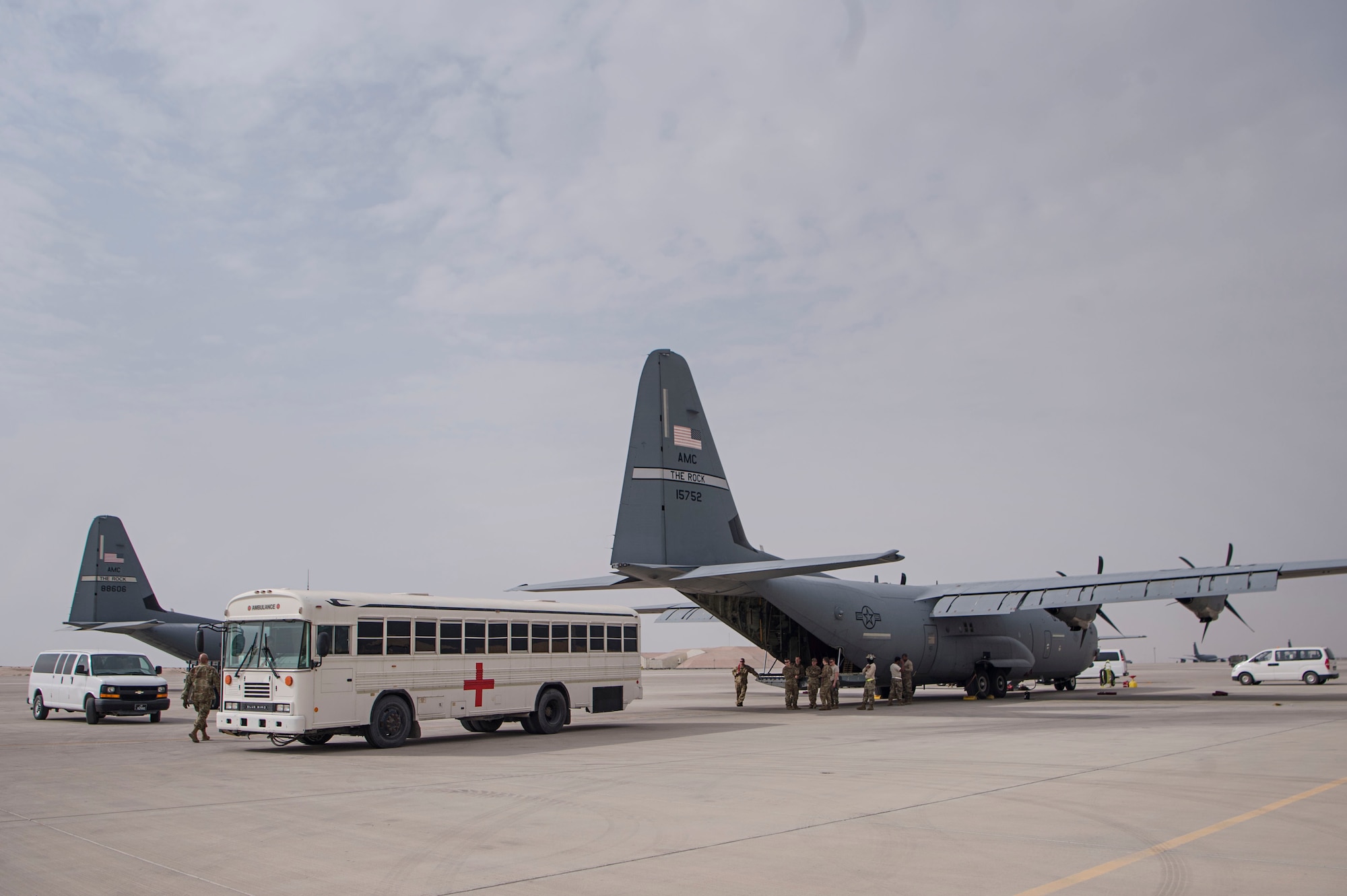 Airmen of the 379th Expeditionary Medical Support Squadron (EMDSS) En Route Patient Staging (ERPS) Facility, finish loading in-transit patients and their luggage onto a bus Feb. 27, 2019, at Al Udeid Air Base, Qatar. Airmen at the 379th EMDSS’s ERPS facility work at both the clinic and on the flightline to ensure safe transport and care is provided to in-transit patients during their stay at Al Udeid before they are moved to locations supporting higher levels of medical treatment, if necessary. (U.S. Air Force photo by Tech. Sgt. Christopher Hubenthal)