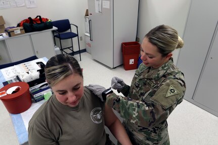 Sgt. Natalie Flory, a health care noncommissioned officer with the Ohio Army National Guard Medical Detachment, administers a flu shot during a periodic health assessment (PHA) Jan. 26, 2019, at Defense Supply Center Columbus in Columbus, Ohio.