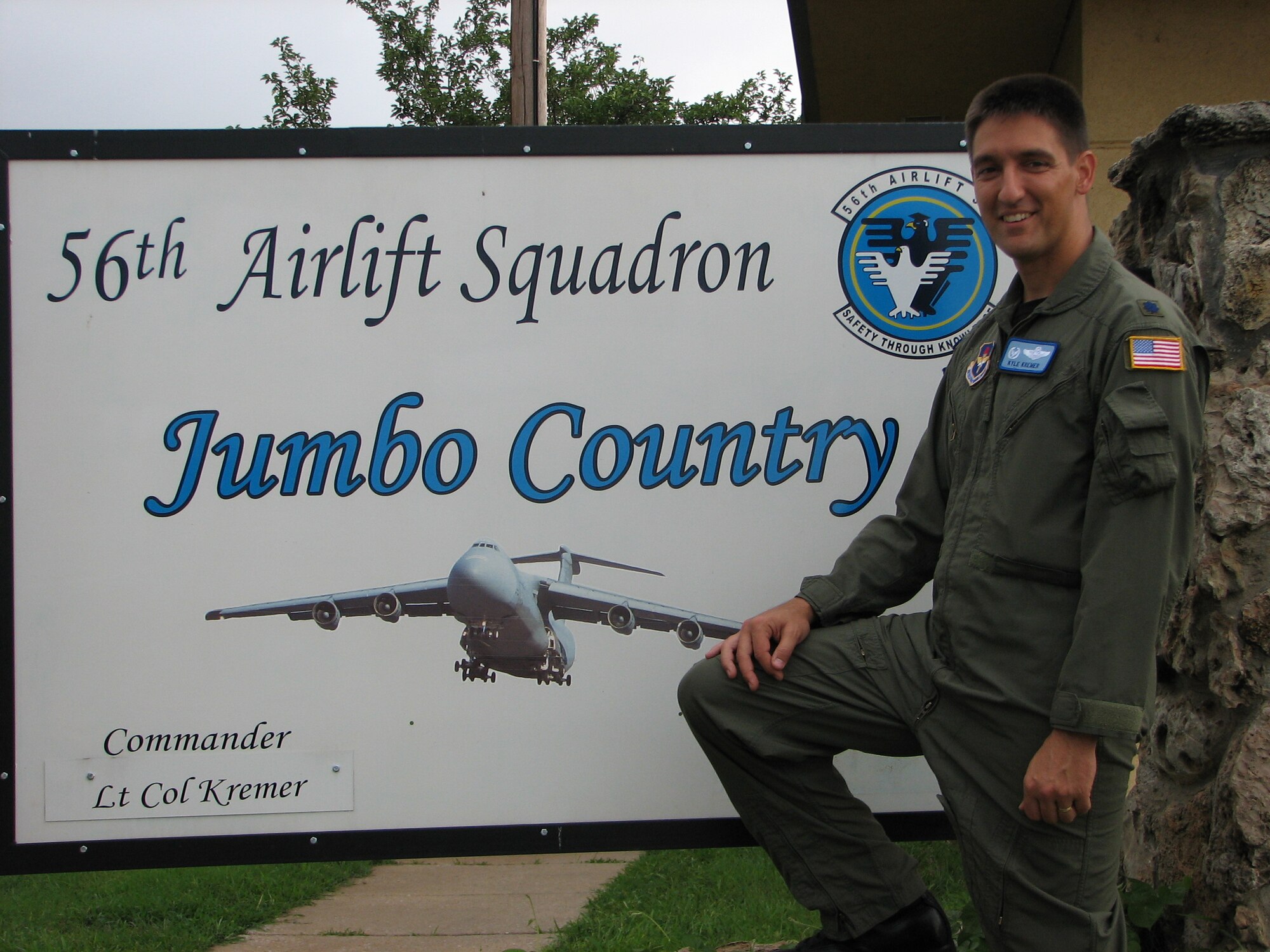 Then Lt. Col. Kyle J. Kremer, former 56th Airlift Squadron commander, stands in front of the 56th AS sign at the 97th Air Mobility Wing in 2007, Altus Air Force Base, Okla. Now Brig. Gen. Kremer is the Director, Global Reach Programs, Office of the Assistant Secretary of the Air Force for Acquisition, Headquarters U.S. Air Force, Arlington, Virginia. (Courtesy photo by Brig. Gen. Kyle J. Kremer)