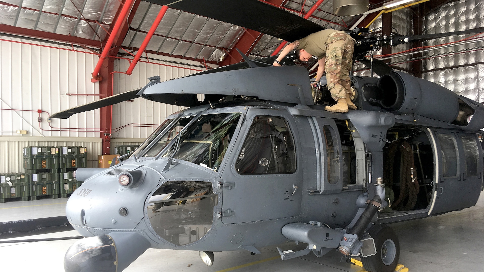 Maintainers check over an HH-60 Pave Hawk helicopter as members of the New York Air National Guard’s 106th Rescue Wing prepare to deploy in support of rescue efforts following Hurricane Michael in October.