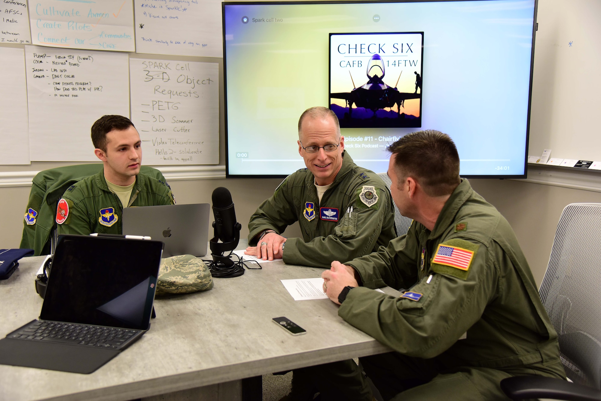 Capt. Phillip Huebner, 37th Flying Training Squadron instructor pilot, and Maj. Ryan Brewer, 14th Flying Training Wing director of innovation, speak to Maj. Gen. Mark Weatherington, deputy commander of Air Education and Training Command, on their Check Six podcast Feb. 21, 2019, on Columbus Air Force Base, Mississippi. Weatherington was the first guest appearance on the podcast. (U.S. Air Force photo by Elizabeth Owens)