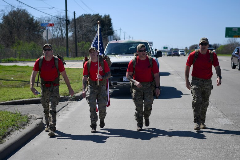 Air Force Special Operations Command Air Commandos march in honor of fallen brethren Feb. 24, 2019, near Houston, Texas. This is the fifth Special Tactics Memorial March since 2009, which honors 20 Special Tactics Airmen who have been killed in action since 9/11. (U.S. Air Force photo by Senior Airman Ridge Shan)