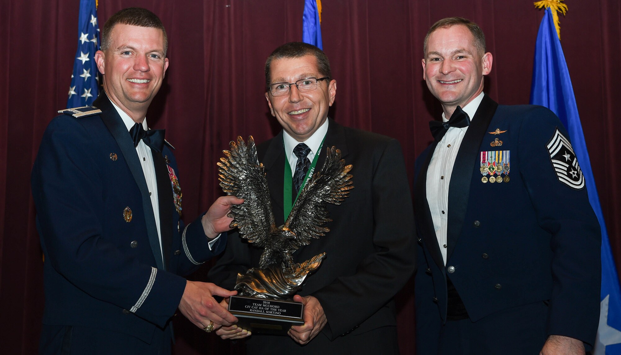 Randall Sortino, 361st Recruiting Squadron, accepts the Civilian Category IIA of the Year award during the 2018 Team McChord Annual Awards Banquet at the McChord Field Club, Joint Base Lewis-McChord, Wash., Feb. 22, 2019. The annual award included both civilian and military members of Team McChord. (U.S. Air Force photo by Senior Airman Tryphena Mayhugh)