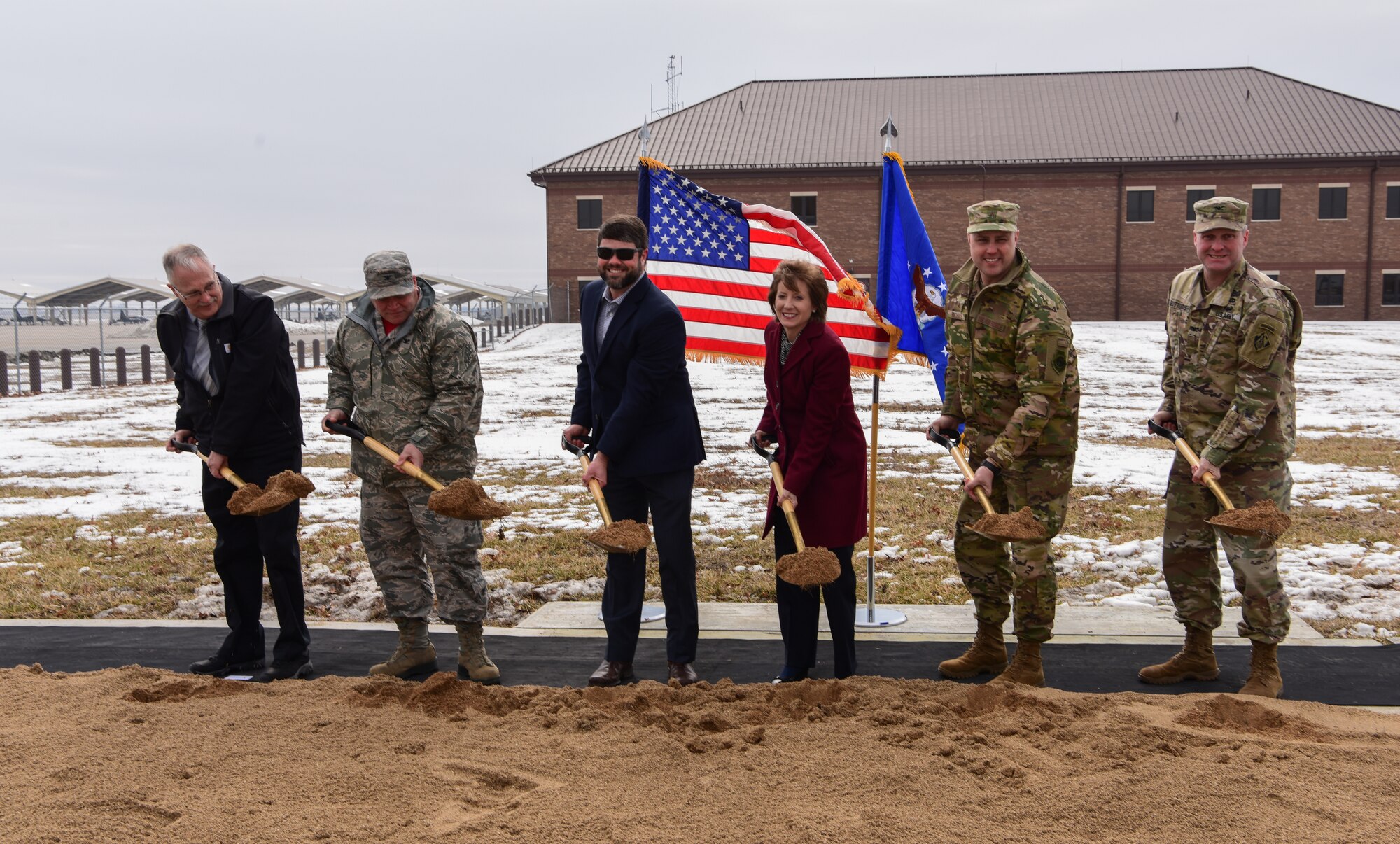 Brig. Gen. John J. Nichols, 509th Bomb Wing commander, Congresswoman Vicky Hartzler and other distinguished guests break ground on the new Operations building construction.