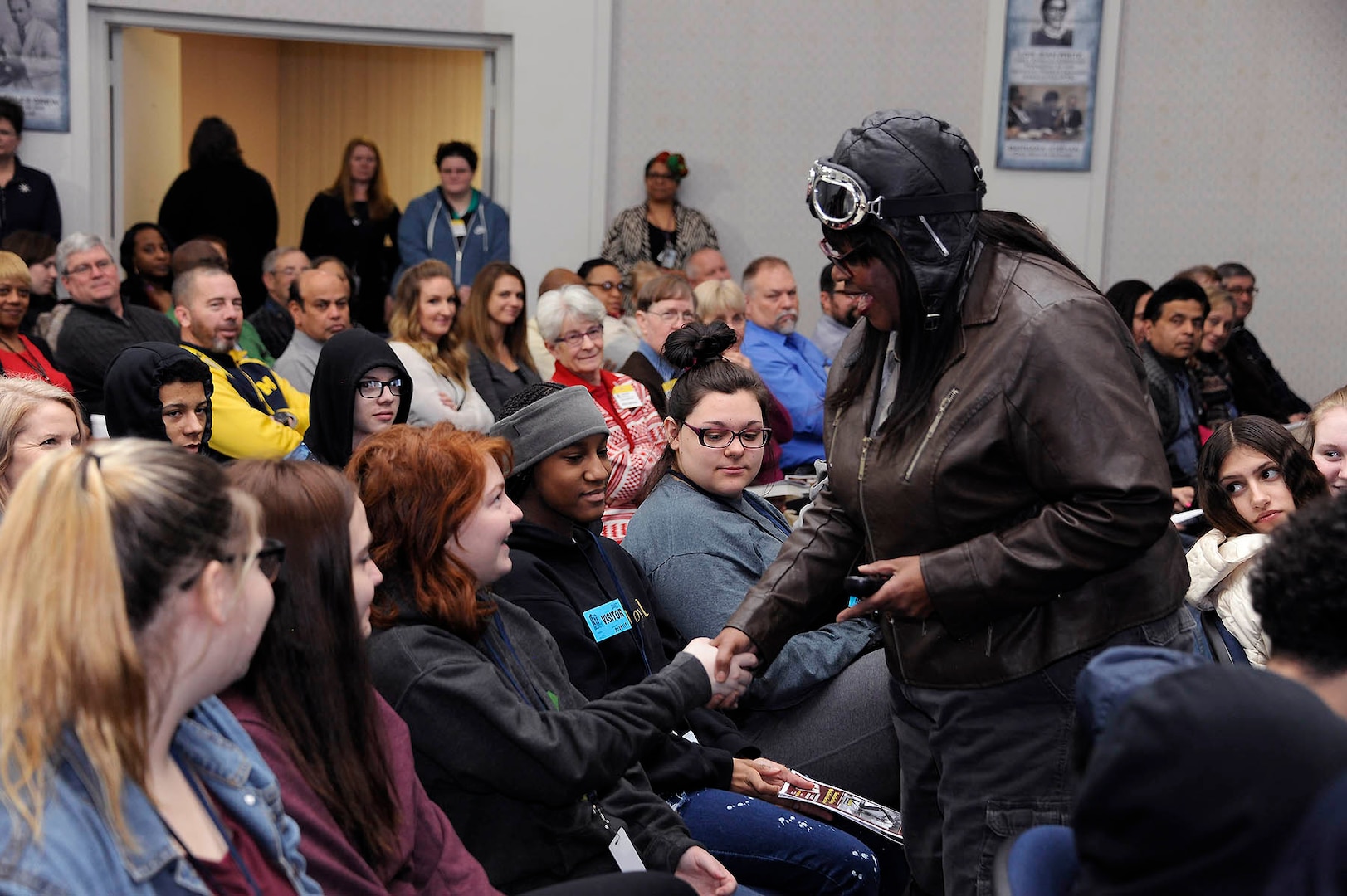 Gigi Coleman works the crowd as her great aunt and daredevil pilot Bessie Coleman during a Black History Month event at DLA Disposition Services headquarters in Michigan Feb. 28.